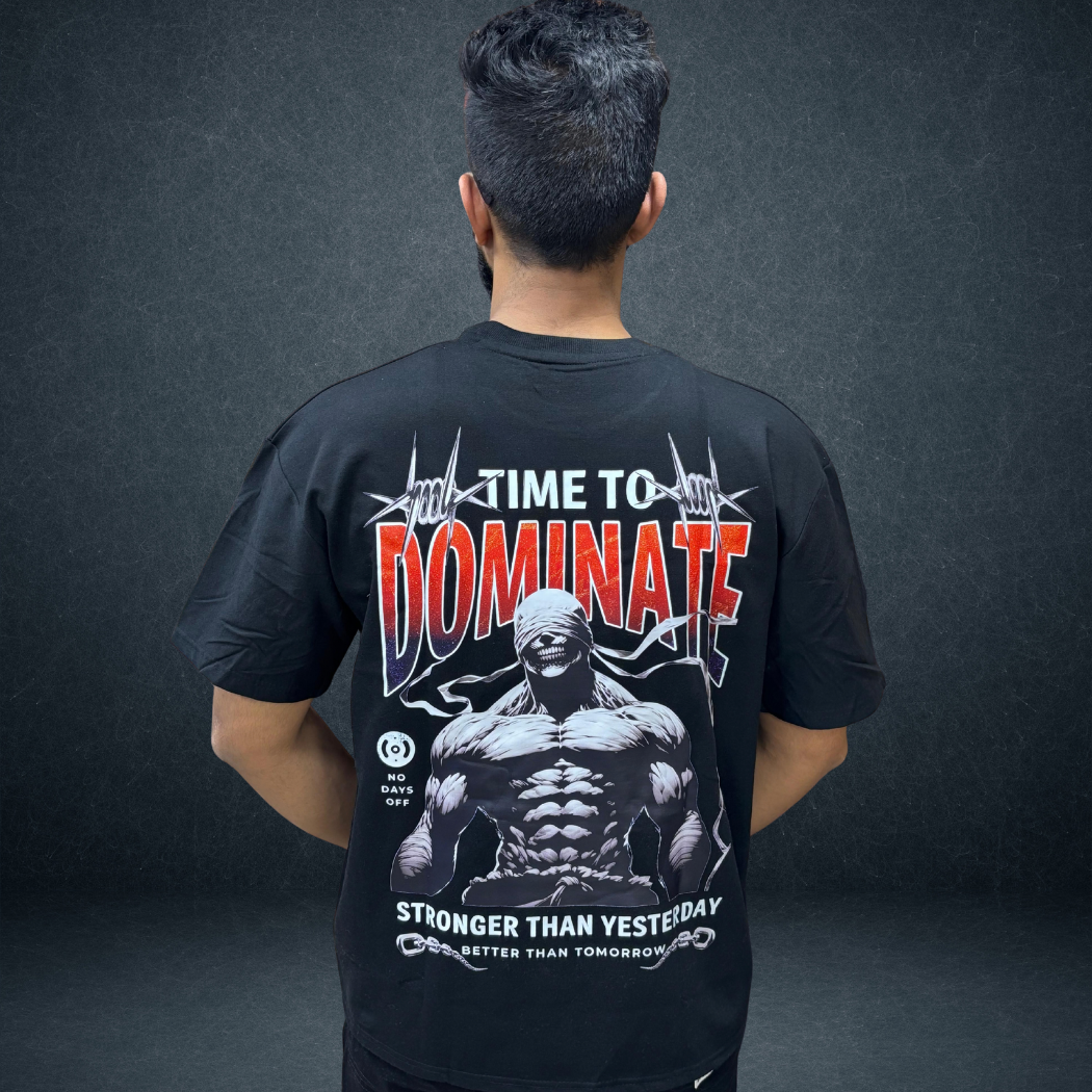 Back view of black DOMINATE oversized tee with bold warrior graphic - Prospera streetwear
