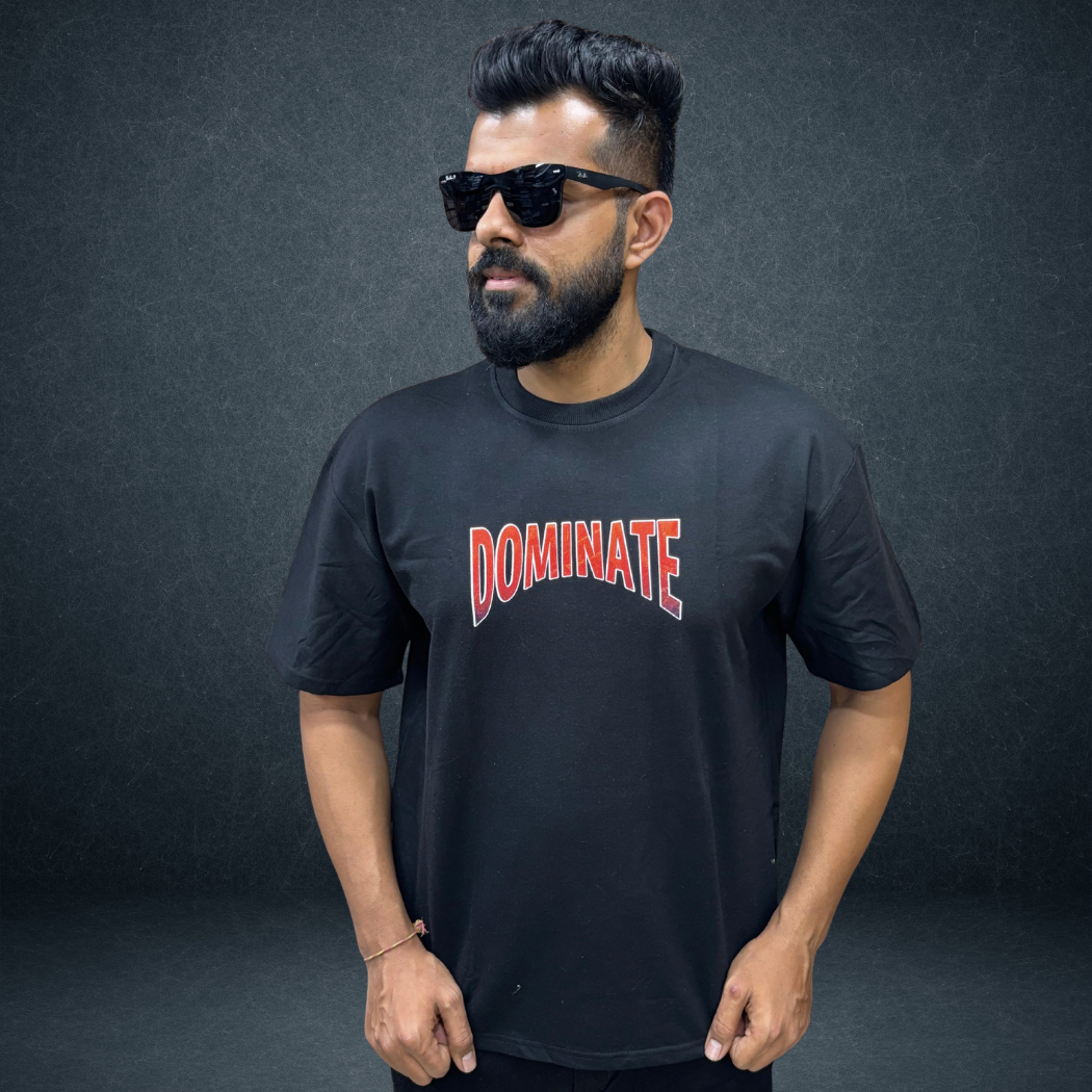 Front view of black DOMINATE oversized tee with bold warrior graphic - Prospera streetwear