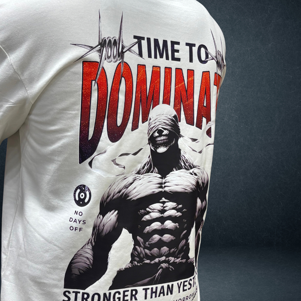 Side angle view of white DOMINATE oversized tee with bold warrior graphic - Prospera streetwear