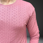 Light pink textured knit fabric detail and pattern close-up