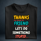 Black oversized cotton t-shirt folded with colourful friendship quote print by Prospera Clothing