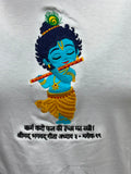Close up of embroidered bal Krishna with flute and peacock feather on white cotton t-shirt with bagwadgita slok