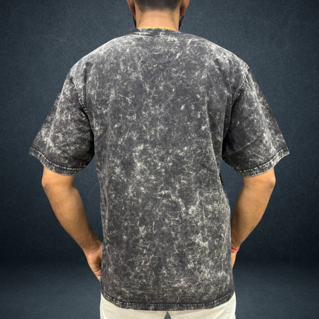 Mehnat Kam AI Zyada oversized acid wash t-shirt in black charcoal  back view male model  Indian streetwear brand Prospera